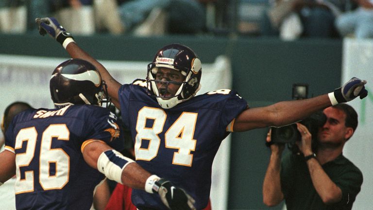 IRVING, :  Minnesota Vikings receiver Randy Moss (C) celebrates his 51 yard touchdown reception on the fourth play of the game versus the Dallas Cowboys at