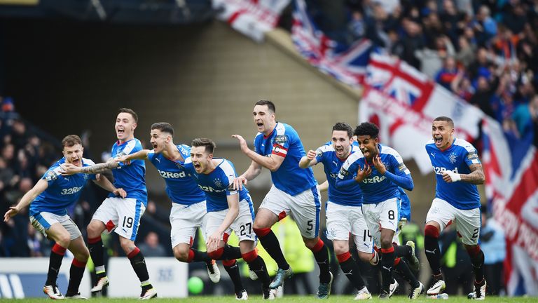 Rangers players celebrate after beating Celtic in a penalty shoot-out during the William Hill Scottish Cup semi-final