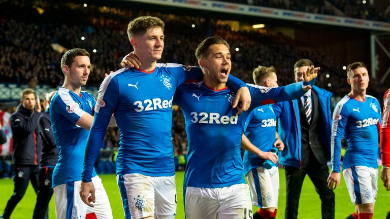 Rangers players celebrate after clinching promotion