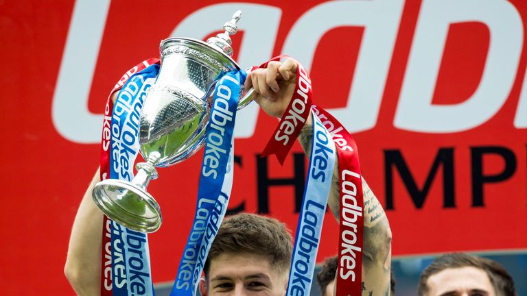 Rangers' Rob Kiernan celebrates with the Championship trophy