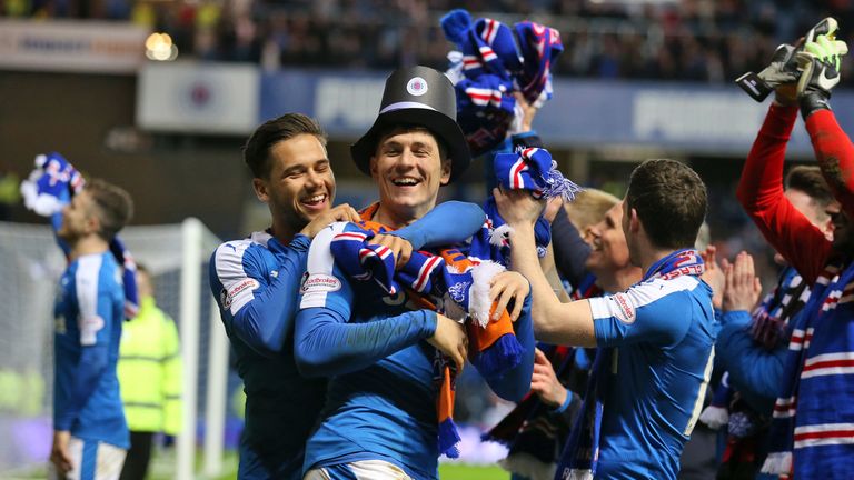 Rangers' Rob Kiernan (centre) and Harry Forrester (left) celebrates after securing the Championship title