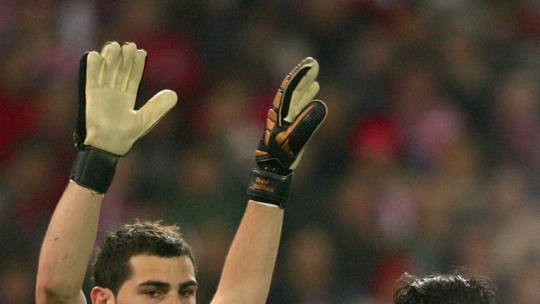 Real Madrid's goalkeeper Iker Casillas (L) holds up his hands by Atletico de Madrid's Sergio Aguero during a La Liga match in 2007