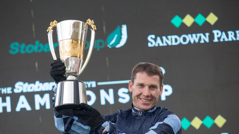 Richard Johnson with the champion jump jockey trophy at Sandown Park