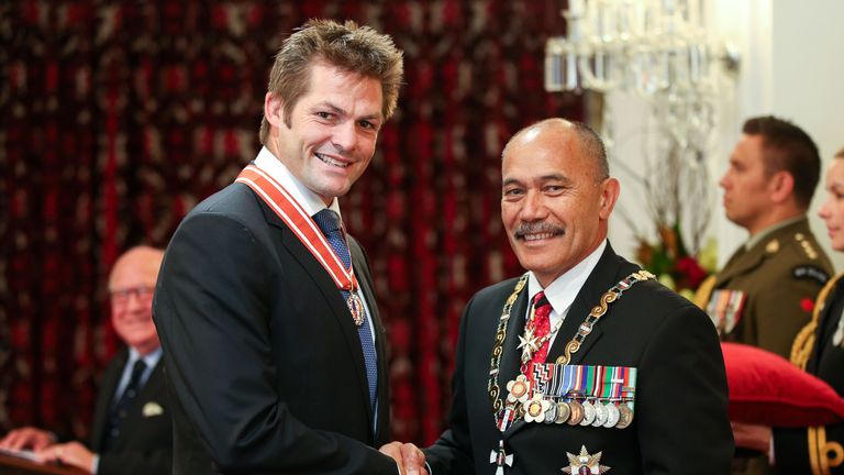 Richie McCaw receives the insignia of a Member of the Order of New Zealand from Governor-General Sir Jerry Mateparae for services to New Zealand