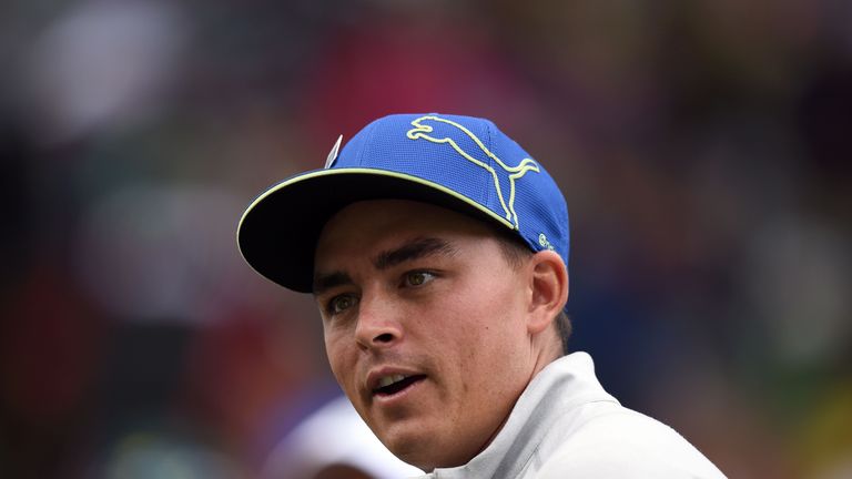 US golfer Rickie Fowler walks to 9th green during the Par 3 contest