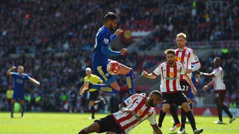 Riyad Mahrez of Leicester City is challenged by Yann M'Vila of Sunderland during the Barclays Premier League match 