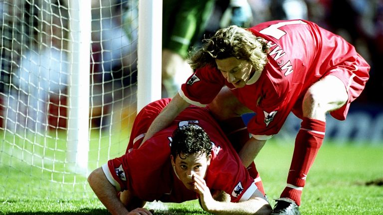 3 April 1999:  Robbie Fowler of Liverpool is pulled away by team-mate Steve McManaman as he celebrates his equaliser against Everton