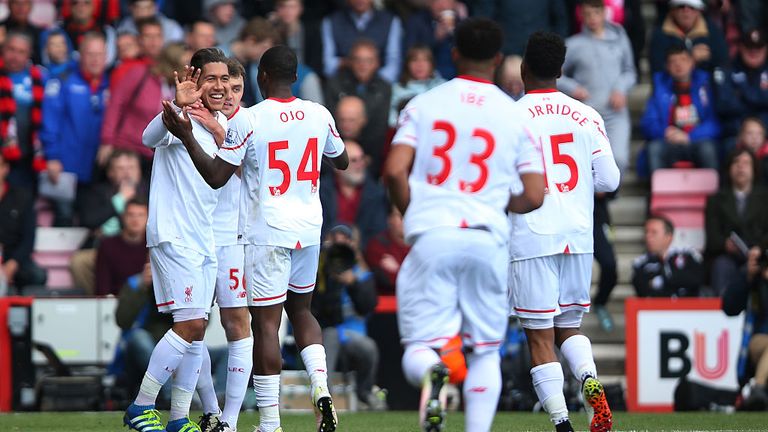 Roberto Firmino of Liverpool celebrates with team mates after scoring the opening goal 