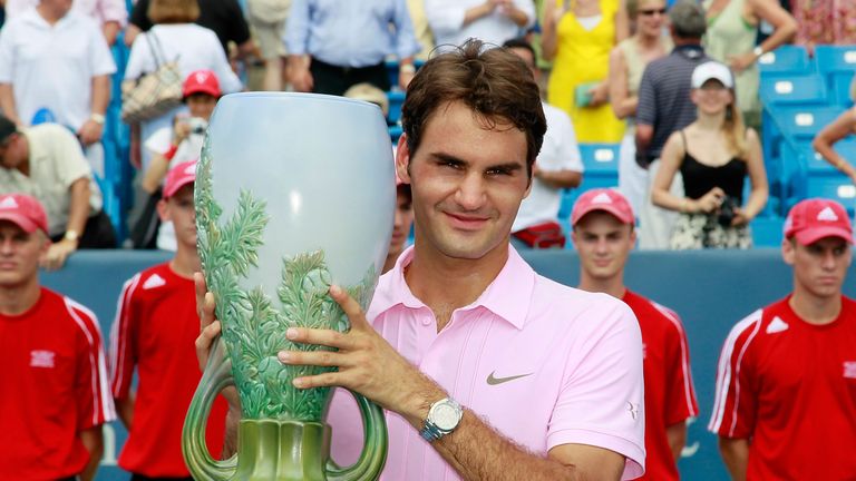 Roger Federer of Switzerland holds the trophy after defeating Mardy Fish during the finals on Day 7 of the Western & Southern Fina