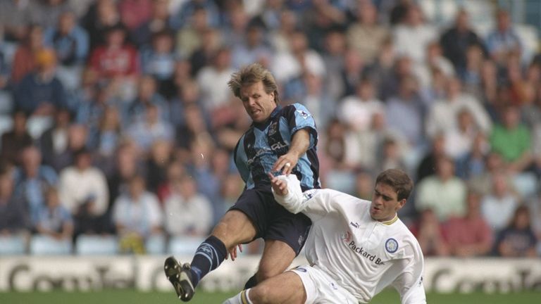 Roland Nilsson of Coventry (left) is tackled by Bruno Ribiero of Leeds United during the FA Carling Premiership match at Highfield Road in Cov