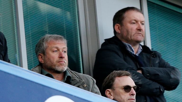 Chelsea's Russian owner Roman Abramovich (L) watches the English Premier League football match between Chelsea and Manchester CIty 