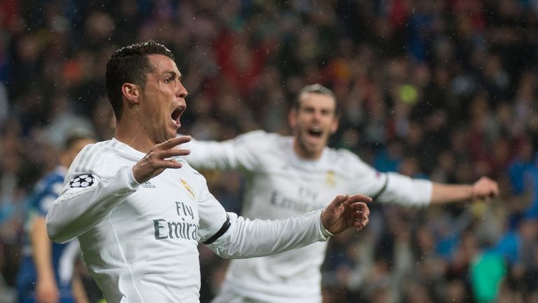 Real Madrid's forward Cristiano Ronaldo celebrates after scoring during the Champions League quarter-final second leg match Real Madrid vs Wolfsburg
