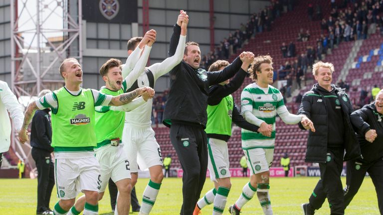 Celtic manager Ronny Deila and his team celebrate at the end of the Ladbrokes Scottish Premiership match at Tynecastle Stadium.