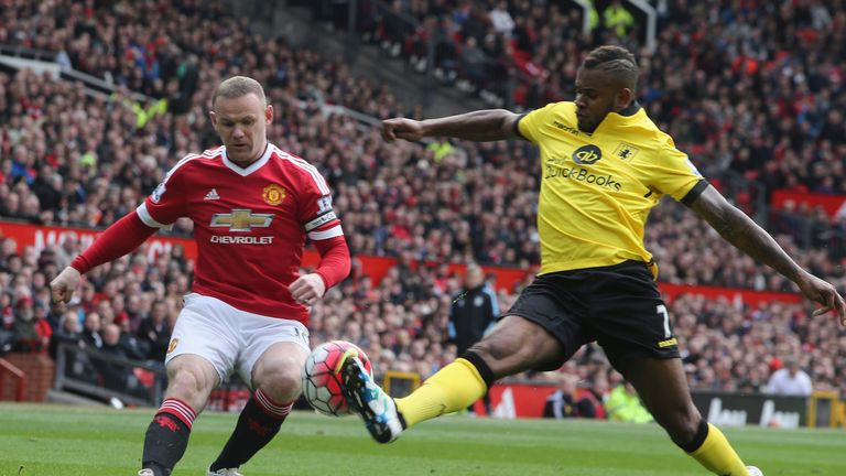 Manchester United's Wayne Rooney challenges with Aston Villa's Leandro Bacuna