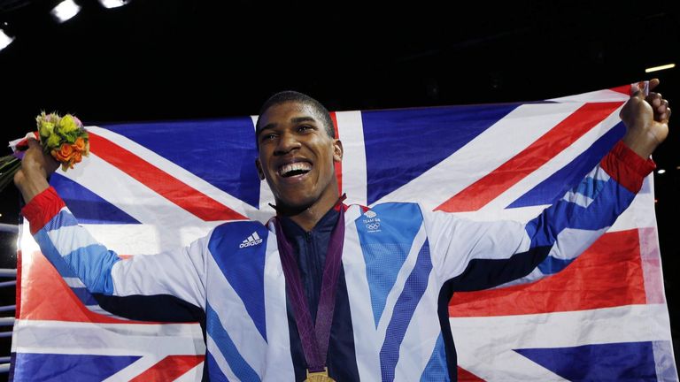 Gold medallist Anthony Joshua of Britain celebrates during the presentation ceremony for the Men's Super Heavy (+91kg) boxing at the London Olympics.