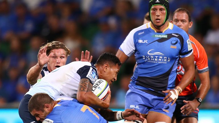 Israel Folau is tackled by Matt Hodgson of Western Force