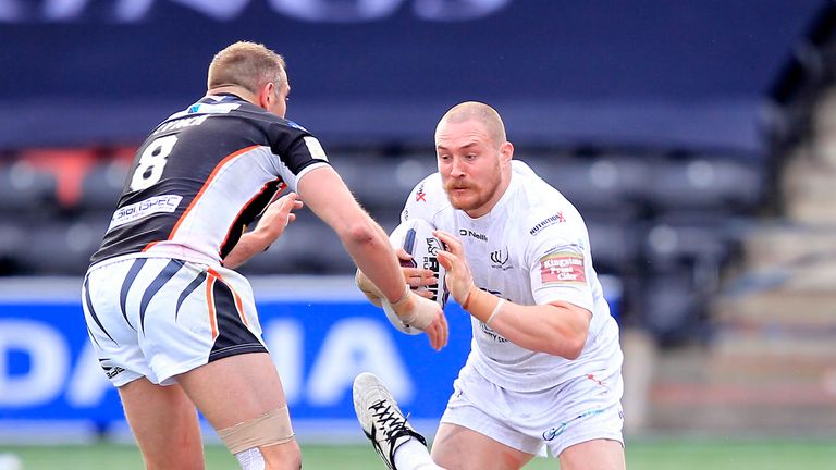 Widnes' Gil Dudson tackled by Castleford's Andy Lynch and Lee Jewitt