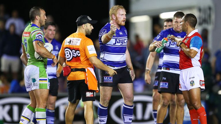 Bulldogs captain James Graham (middle) speaks with referee Ashley Klein