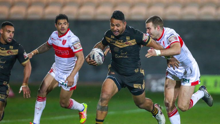 Catalans' Krisnan Inu is tackled by Hull KR's Iain Thornley