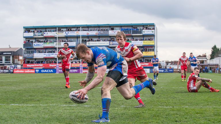 Wakefield's Tom Johnstone scores a try against Salford