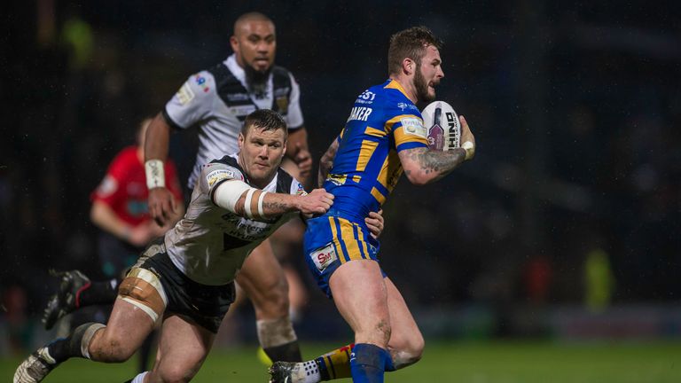 Hull FC's Kirk Yeaman holds on to tackle Leeds' Zak Hardaker