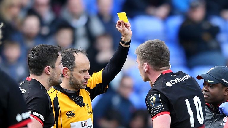 Owen Farrell of Saracens is shown the yellow card by referee Romain Poite