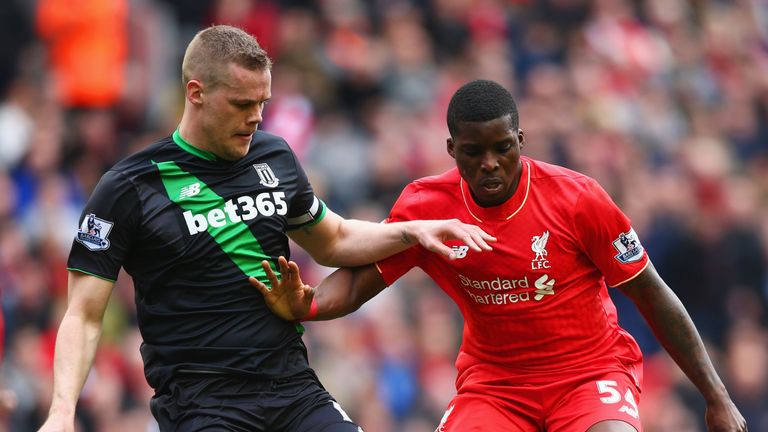 LIVERPOOL, UNITED KINGDOM - APRIL 10:  Sheyi Ojo of Liverpool holds off Ryan Shawcross of Stoke City during 