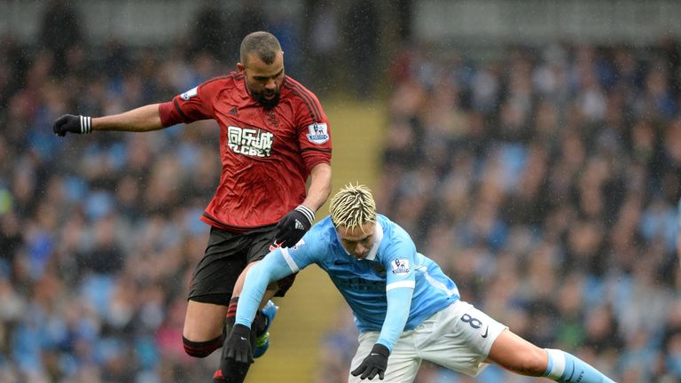 Samir Nasri tumbles under Sandro's challenge