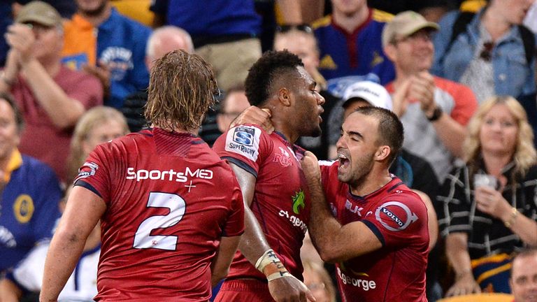 Samu Kerevi of the Reds celebrates scoring a try 