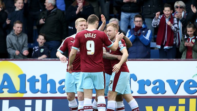 Scott Arfield of Burnley celebrates the opening goal against Leeds with his team-mates 