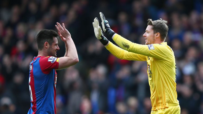 Scott Dann (L) and Wayne Hennessey (R) celebrate victory over Norwich