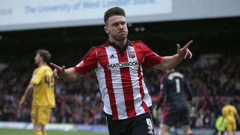 BRENTFORD, ENGLAND - APRIL 30: Scott Hogan of Brentford celebrates scoring during the Sky Bet Championship match between Brentford and Fulham at Griffin Pa