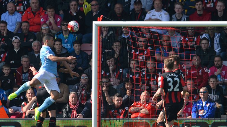 Manchester City's Argentinian striker Sergio Aguero (L) jumps to head home their third goal