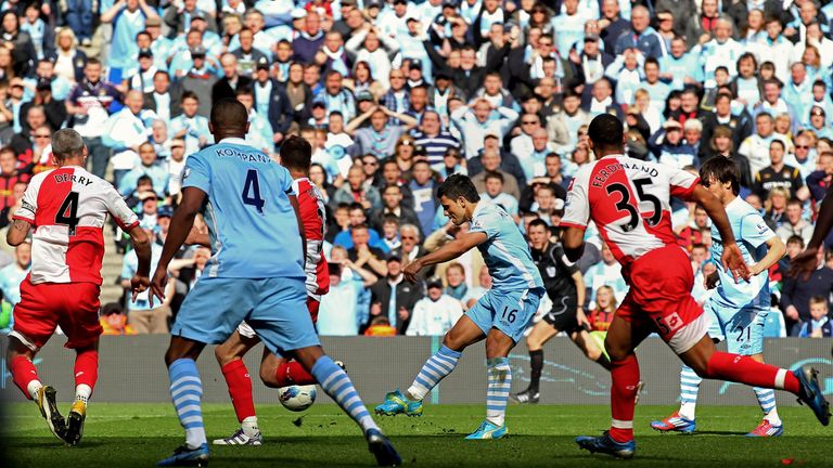 MANCHESTER, ENGLAND - MAY 13:  Sergio Aguero of Manchester City scores his team's third and matchwinning goal during the Barclays Premier League match betw
