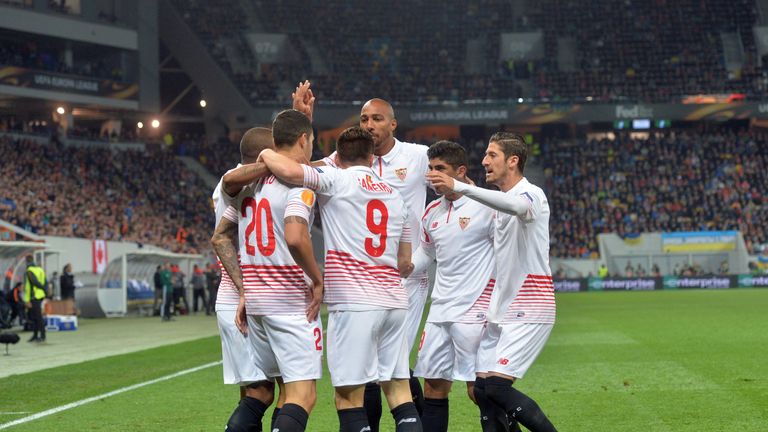 Sevillas players react after opening the scoring against FC Shakhtar during the UEFA Europa League semi-final football match FC Shakhtar Donetsk vs  Sevill