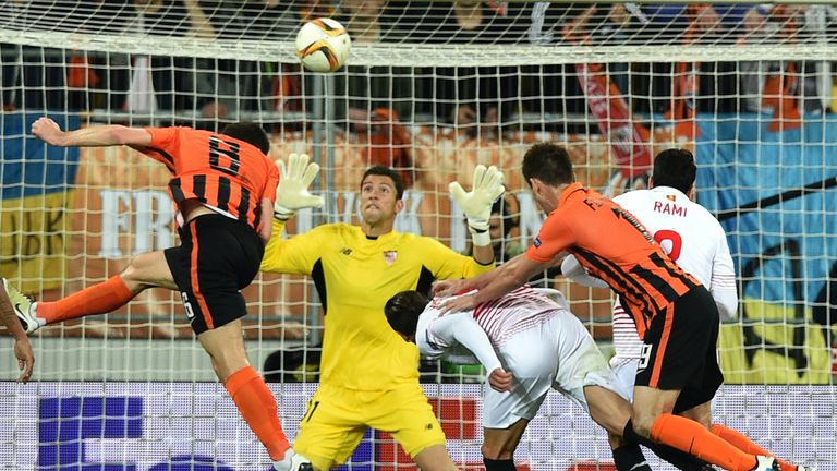 Shakhtar Donetsk's Taras Stepanenko (L) scores during the UEFA European League, semi-final first leg football match between Sevilla FC and Shakhtar Donetsk
