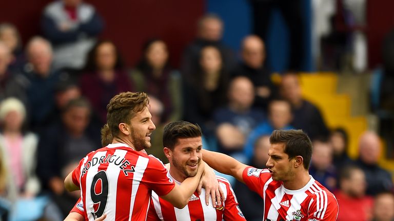 Shane Long of Southampton celebrates with Jay Rodriguez of Southampton and Cedric Soares of Southampton after scoring against Aston Villa
