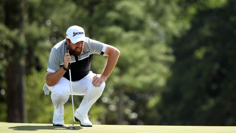 Shane Lowry of Ireland lines up a putt for bogey on the 18th green during the second round of the 2016 Masters Tournament