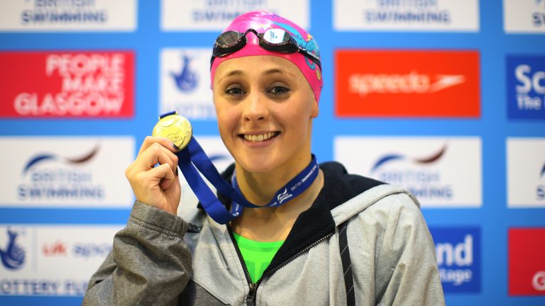 GLASGOW, SCOTLAND - APRIL 17:  Siobhan-Marie O'Connor poses with her gold medal from the Women's 100m Breaststroke during Day Six of The British Swimming C
