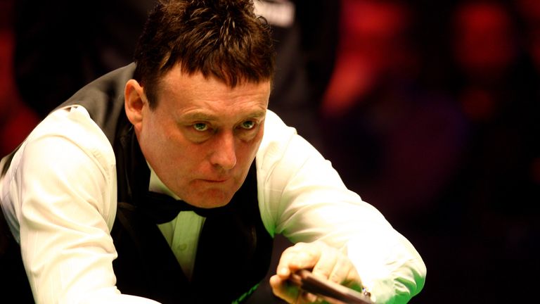 Jimmy White of England lines up a shot during his game against Mark King