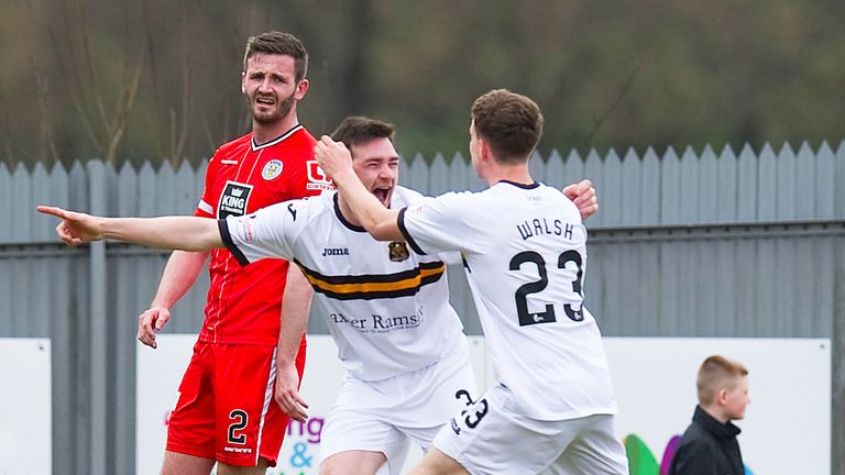 Dumbarton celebrate after a cross by Mark Docherty is  knocked into his own net by St Mirren's Keith Watson