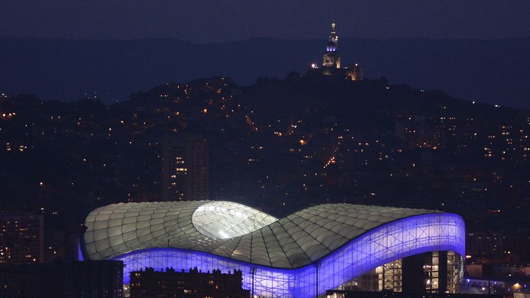 A picture taken on November 2, 2014 shows the illuminated new Velodrome Stadium at sunset in Marseille, 