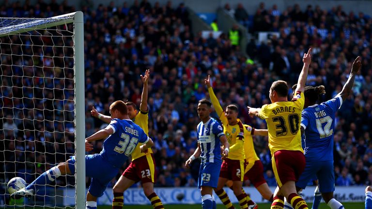 Steve Sidwell of Brighton & Hove Albion clears a ball off the line 