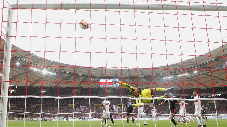 Stuttgart keeper Przemyslaw Tyton makes a dramatic save at the Mercedes-Benz Arena but he was unable to prevent Bayern Munich from winning 3-1