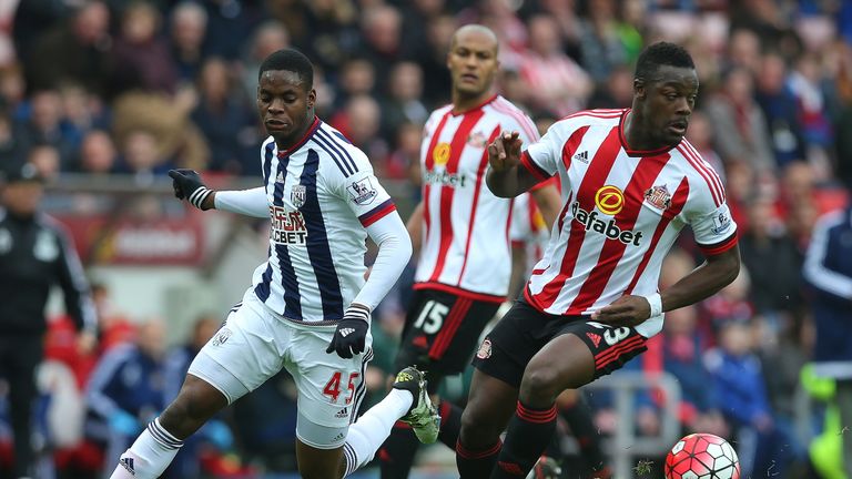 Lamine Kone of Sunderland and Jonathan Leko, who made his Premier League debut, compete for the ball 