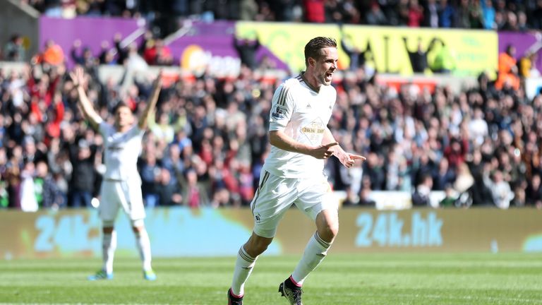 Gylfi Sigurdsson celebrates scoring Swansea City's opener against Chelsea