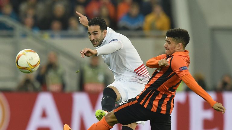 Taison (R) of FC Shakhtar vies for a ball with Adil Rami (L) of Sevilla FC during the UEFA Europa League semi-final football match FC Shakhtar Donetsk vs  