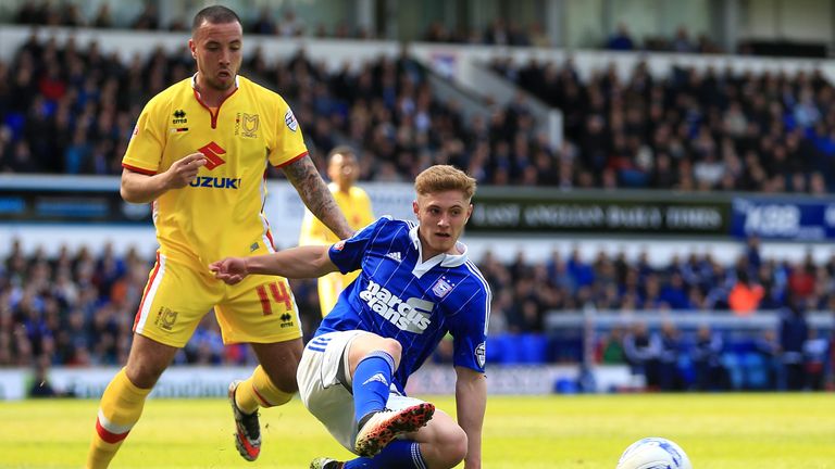 IPSWICH, ENGLAND - APRIL 30:  Teddy Bishop of Ipswich Town and Samir Carruthers of MK Dons compete for the ball during the Sky Bet Championship match betwe