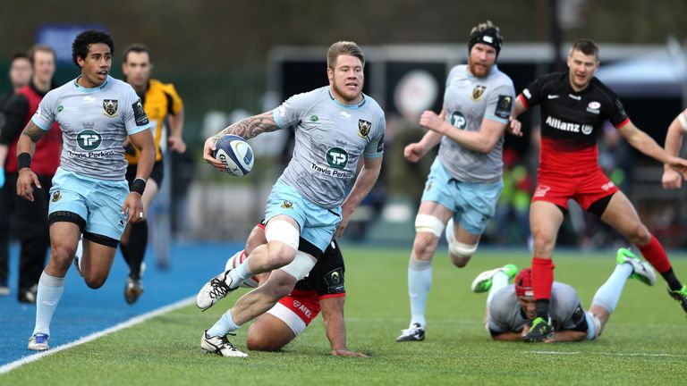 Teimana Harrison of Northampton breaks with the ball against Saracens