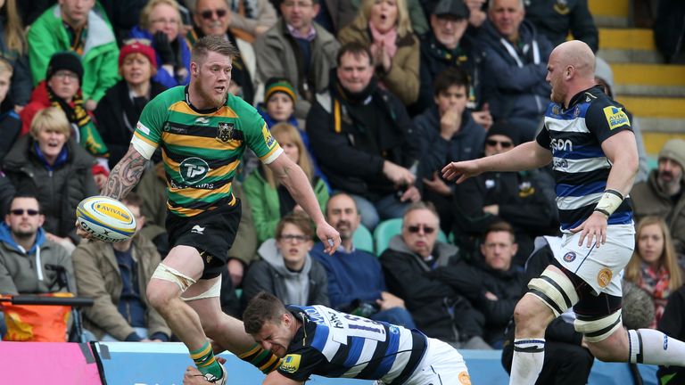 NORTHAMPTON, ENGLAND - APRIL 30:  Teimana Harrison of Northampton off loads the ball during the Aviva Premiership match between Northampton Saints and Bath